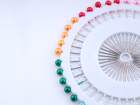 tailoring pins on a light backgroundの写真素材