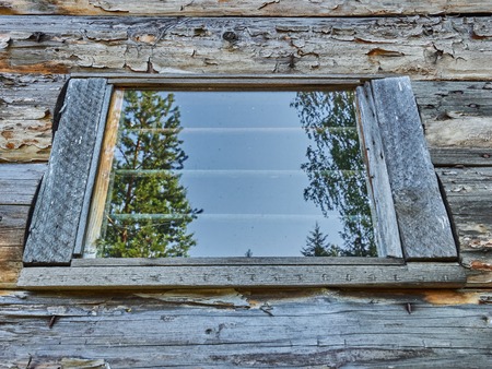 window on the background of a wooden wall