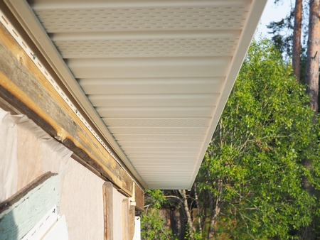 Construction of the frame house. Siding installation