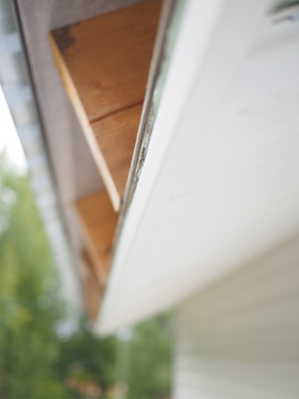 Construction of the frame house. Siding installation