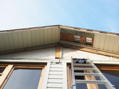 Construction of the frame house. Siding installationのeditorial素材