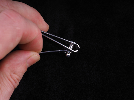 nail clippers on black background