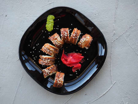 Japanese kitchen. Sushi and rolls on gray concrete backgroundの写真素材
