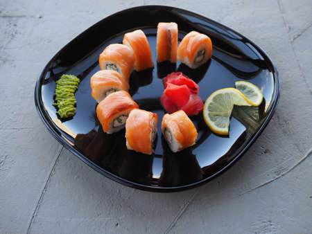 Japanese kitchen. Sushi and rolls on gray concrete backgroundの写真素材