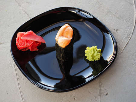 Japanese kitchen. Sushi and rolls on gray concrete backgroundの写真素材