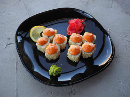 Japanese kitchen. Sushi and rolls on gray concrete backgroundの写真素材