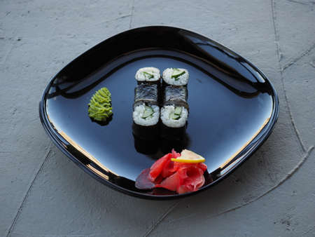 Japanese kitchen. Sushi and rolls on gray concrete backgroundの写真素材