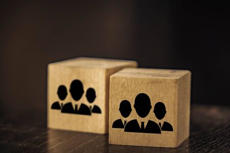 wooden cubes image of staff on a black background.の写真素材