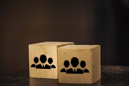 wooden cubes image of staff on a black background.の写真素材