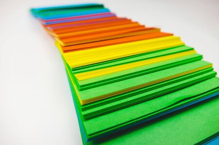 A stack of multicolored note papers on an isolated white background. isolates.の写真素材