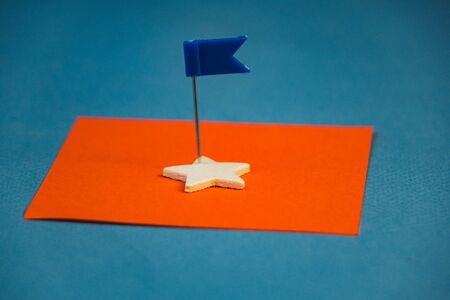 Wooden cubes in the form of a star on a blue backgroundの写真素材