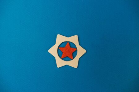wooden cube lying on a blue background.の写真素材