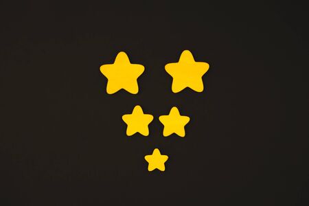 yellow stars on black background.の写真素材