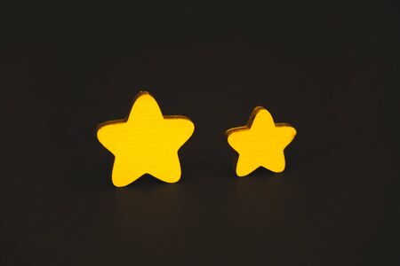 yellow stars on black background.の写真素材