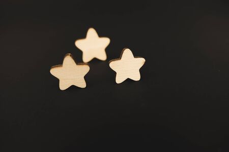 three white stars on a black background.の写真素材