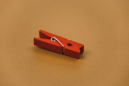 colorful clothespins on a brown background.の写真素材