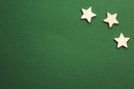 white stars on a green background