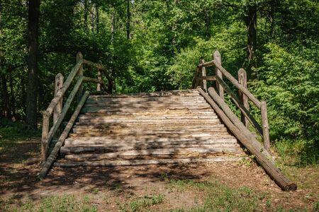 Wooden bridge in the summer park. side viewの写真素材