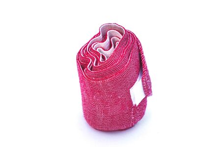 Red elastic bandage on a white background.の写真素材