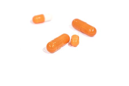 tablets orange, isolated on a white background. medicineの写真素材