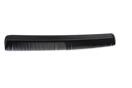 black comb isolated on white background. the concept of beauty.の写真素材