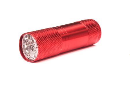 red plastic flashlight isolated on white backgroundの写真素材