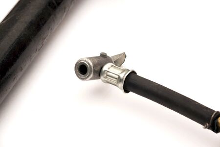 rubber hose with metal nozzle for high pressure durable black with metal tip on white background isolated.の写真素材