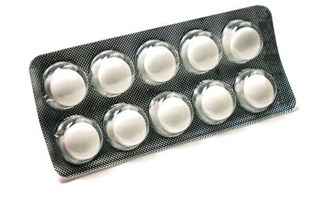 white tablets in a package isolated on a white background.の写真素材