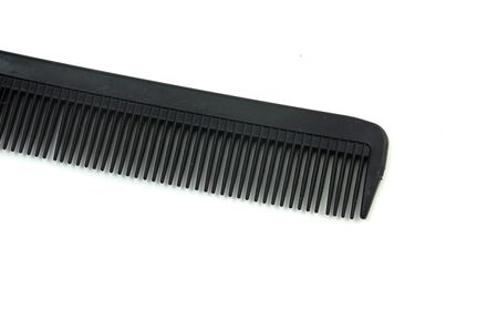 black hair comb isolated on white backgroundの写真素材