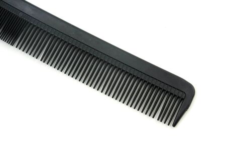 black hair comb isolated on white backgroundの写真素材