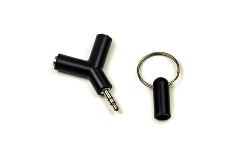 Audio adapter with two microphone and headphone jacks isolated on white backgroundの写真素材