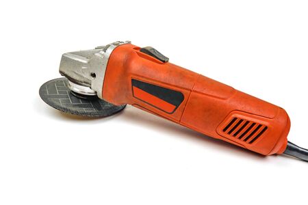 Big powerful angle grinder with abrasive disk isolated on a white background. Angle grinders on a...