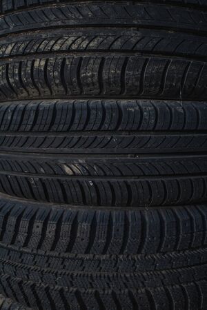 car rubber tires lying on top of each otherの写真素材
