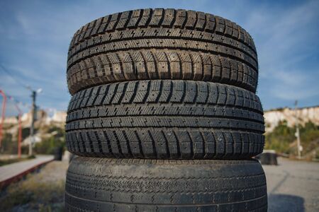 car rubber tires lying on top of each other