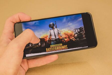 Los Angeles, USA - September 10, 2019: screensaver games pubg on the phone.のeditorial素材