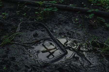 Soil Background mud puddle marsh well blue sky rice.の写真素材