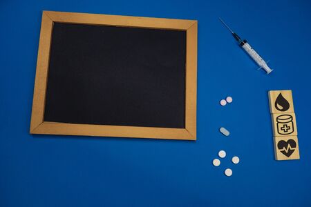 HEPATITIS CONCEPT Fitness and weight loss concept, fruit and tape measure on a wooden table, top view, Blank board copy spaceの写真素材