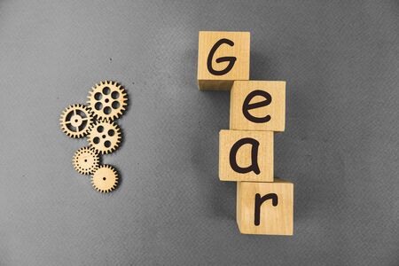 wooden mechanisms, with the inscription gear on a blue background.の写真素材