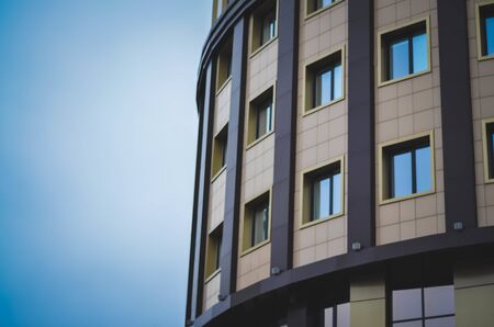 office building close-up in against the blue sky.