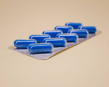 package with capsules of blue color in the amount of ten pieces.の写真素材