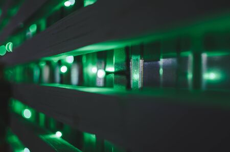 so many green lanterns on the wall at nightの写真素材