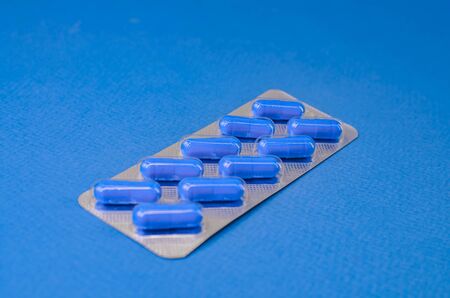 blue pills a blue backgroundの写真素材