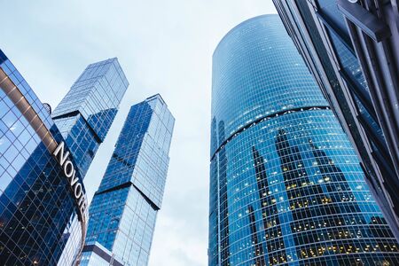 Moscow, Russia - January 10, 2020: Glass skyscrapers in Moscow with a view from below.