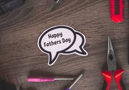 Happy father's day on a white cloud in the middle of the instruments.の写真素材