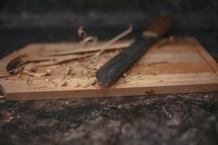 wooden bar lying with a knife on the table.の写真素材