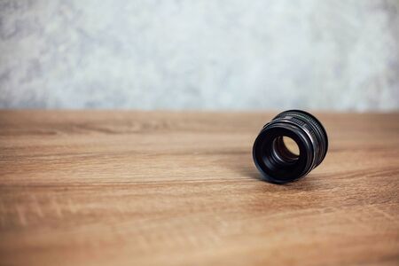 old manual lens on a wooden background.の写真素材