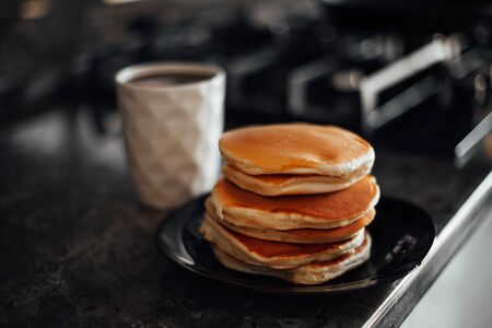 cottage cheese pancake with tea on a wooden stand.の写真素材