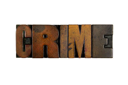 The word CRIME written in vintage wood letterpress type