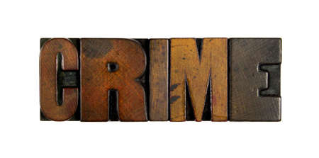 The word CRIME written in vintage wood letterpress typeの写真素材