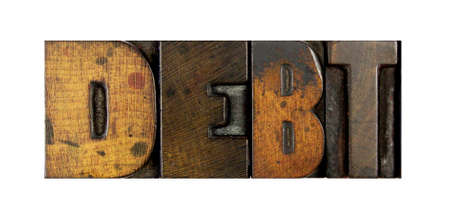 The word DEBT written in vintage letterpress typeの写真素材